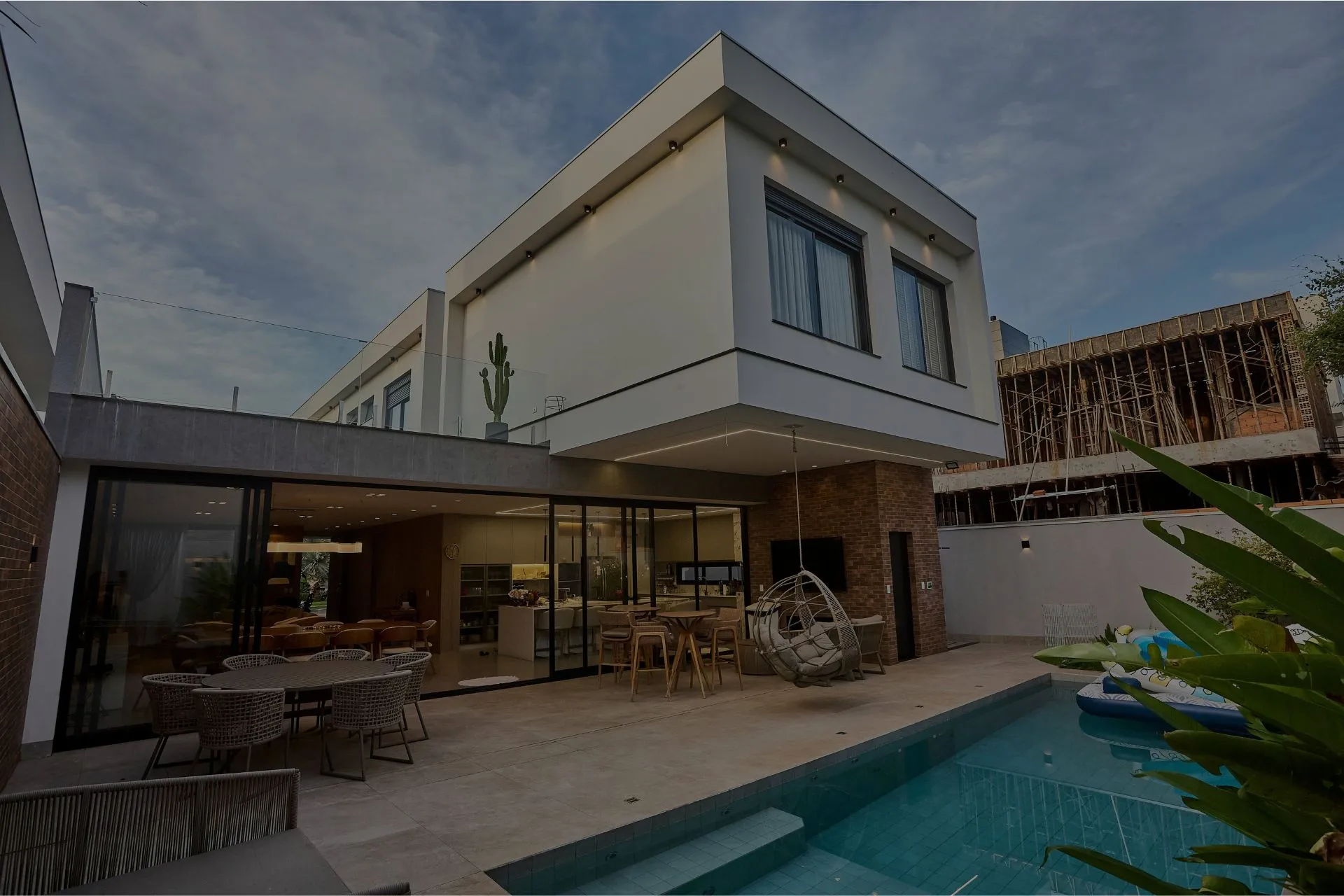 A modern two-story home at dusk